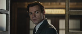 Movie still from “Christopher Robin” (2018), directed by Marc Forster – A person wearing a suit and tie; Close Up shot, Low angle