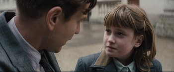 Movie still from “Christopher Robin” (2018), directed by Marc Forster – A young boy and a man are looking at one another; Close Up shot, Over the shoulder angle