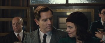 Movie still from “Christopher Robin” (2018), directed by Marc Forster – A man and a woman standing next to each other; Close Up shot, Low angle