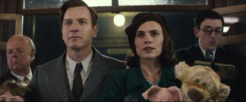 Movie still from “Christopher Robin” (2018), directed by Marc Forster – A man and a woman standing next to each other; Close Up shot, Low angle