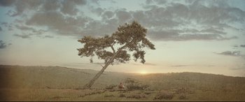 Movie still from “Christopher Robin” (2018), directed by Marc Forster – A painting of a tree in the middle of a field; Extreme Wide shot, Low angle