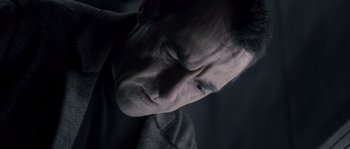 Movie still from “Chrysalis” (2007), directed by Julien Leclercq – A man's face in the dark; Close Up shot, High angle