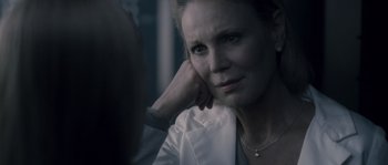 Movie still from “Chrysalis” (2007), directed by Julien Leclercq – A person with her hand on her chin; Close Up shot, Over the shoulder angle