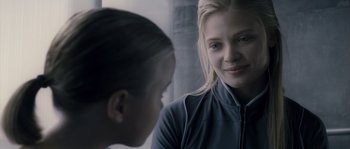 Movie still from “Chrysalis” (2007), directed by Julien Leclercq – A young woman and a young boy are looking at each other; Close Up shot, Over the shoulder angle