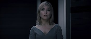 Movie still from “Chrysalis” (2007), directed by Julien Leclercq – A person wearing a blue shirt; Close Up shot, Low angle