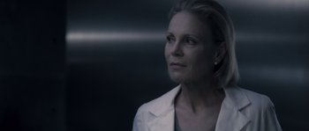 Movie still from “Chrysalis” (2007), directed by Julien Leclercq – A person wearing a white jacket; Close Up shot, Low angle