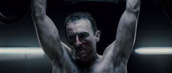 Movie still from “Chrysalis” (2007), directed by Julien Leclercq – A person with blood on his face; Close Up shot, Low angle