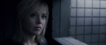 Movie still from “Chrysalis” (2007), directed by Julien Leclercq – A person looking at the camera; Close Up shot, Over the shoulder angle