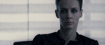 Movie still from “Chrysalis” (2007), directed by Julien Leclercq – A person wearing a black shirt; Close Up shot, Low angle