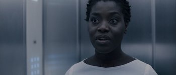 Movie still from “Chrysalis” (2007), directed by Julien Leclercq – A person with a surprised look on their face; Close Up shot, Over the shoulder angle