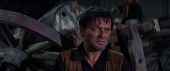 Movie still from “Cimarron” (1960), directed by Charles Walters – A person with wet hair; Close Up shot, Low angle