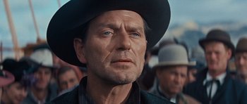 Movie still from “Cimarron” (1960), directed by Charles Walters – A person wearing a hat; Close Up shot, Low angle