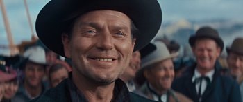 Movie still from “Cimarron” (1960), directed by Charles Walters – A person wearing a cowboy hat; Close Up shot, Low angle