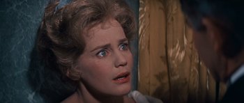 Movie still from “Cimarron” (1960), directed by Charles Walters – The face of a woman with blue eyes; Close Up shot, Over the shoulder angle