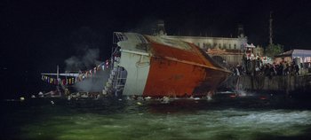 Movie still from “Circus World” (1964), directed by Henry Hathaway – A ship that is in the water and has been sunk; Extreme Wide shot, High angle