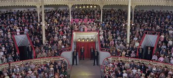 Movie still from “Circus World” (1964), directed by Henry Hathaway – A large crowd of people watching a performance; Extreme Wide shot, High angle