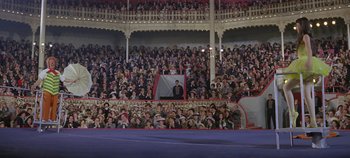 Movie still from “Circus World” (1964), directed by Henry Hathaway – A large crowd of people in a large stadium; Wide shot, High angle
