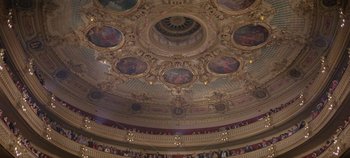 Movie still from “Circus World” (1964), directed by Henry Hathaway – The ceiling of a large theater with paintings on it's walls; Extreme Wide shot, High angle