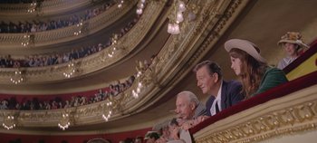Movie still from “Circus World” (1964), directed by Henry Hathaway – A group of people sitting in a theater; Wide shot, Low angle