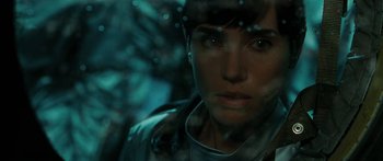 Movie still from “The Day the Earth Stood Still” (2008), directed by Scott Derrickson – A person's face in a dark room; Close Up shot, Over the shoulder angle