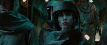 Movie still from “The Day the Earth Stood Still” (2008), directed by Scott Derrickson – A woman in a black suit and a helmet; Close Up shot, Over the shoulder angle