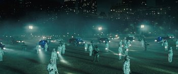 Movie still from “The Day the Earth Stood Still” (2008), directed by Scott Derrickson – A group of people standing in the middle of a street; Extreme Wide shot, High angle