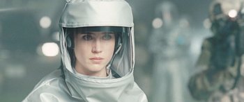 Movie still from “The Day the Earth Stood Still” (2008), directed by Scott Derrickson – A woman wearing a protective suit and a helmet; Close Up shot, Over the shoulder angle