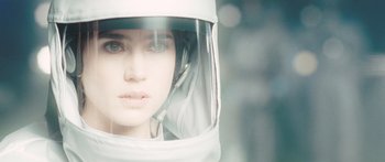 Movie still from “The Day the Earth Stood Still” (2008), directed by Scott Derrickson – A woman wearing a helmet looking at the camera; Close Up shot, Overhead angle