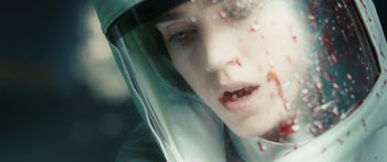 Movie still from “The Day the Earth Stood Still” (2008), directed by Scott Derrickson – A woman wearing a helmet looking out of a car window; Extreme Close Up shot, Overhead angle
