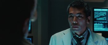 Movie still from “The Day the Earth Stood Still” (2008), directed by Scott Derrickson – A man in a white suit looking into a mirror; Close Up shot, Low angle
