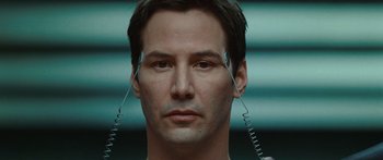 Movie still from “The Day the Earth Stood Still” (2008), directed by Scott Derrickson – A man with two wires attached to his head; Close Up shot, Overhead angle