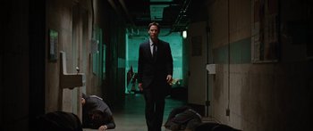 Movie still from “The Day the Earth Stood Still” (2008), directed by Scott Derrickson – A man in a suit walking down a hall way; Wide shot, Low angle