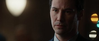 Movie still from “The Day the Earth Stood Still” (2008), directed by Scott Derrickson – A person wearing a suit and tie; Close Up shot, Over the shoulder angle