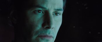 Movie still from “The Day the Earth Stood Still” (2008), directed by Scott Derrickson – A man's face in a dark room; Close Up shot, Low angle