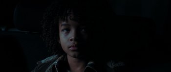 Movie still from “The Day the Earth Stood Still” (2008), directed by Scott Derrickson – A young person's face in the dark; Close Up shot, High angle