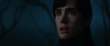 Movie still from “The Day the Earth Stood Still” (2008), directed by Scott Derrickson – A woman's face in the dark; Close Up shot, Over the shoulder angle