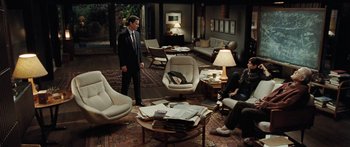 Movie still from “The Day the Earth Stood Still” (2008), directed by Scott Derrickson – A group of people sitting in a living room; Wide shot, High angle