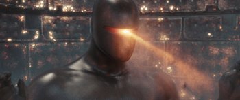 Movie still from “The Day the Earth Stood Still” (2008), directed by Scott Derrickson – A man in a black suit with a light shining on his face; Extreme Close Up shot, High angle