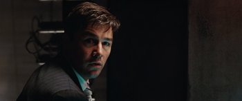 Movie still from “The Day the Earth Stood Still” (2008), directed by Scott Derrickson – A person wearing a suit and tie; Close Up shot, Low angle