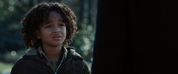 Movie still from “The Day the Earth Stood Still” (2008), directed by Scott Derrickson – A young girl with curly brown hair standing in a wooded area; Close Up shot, Low angle