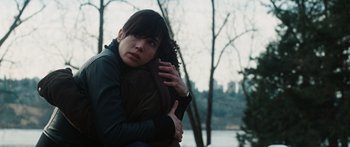 Movie still from “The Day the Earth Stood Still” (2008), directed by Scott Derrickson – A woman holding her head in her hands; Close Up shot, Over the shoulder angle