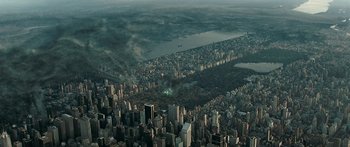 Movie still from “The Day the Earth Stood Still” (2008), directed by Scott Derrickson – An aerial view of a large city with smoke billowing out of it; Extreme Wide shot, Overhead angle