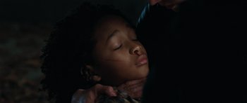 Movie still from “The Day the Earth Stood Still” (2008), directed by Scott Derrickson – A woman is getting her hair cut by a barber; Close Up shot, High angle