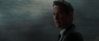 Movie still from “The Day the Earth Stood Still” (2008), directed by Scott Derrickson – A person wearing a suit and tie; Close Up shot, Low angle