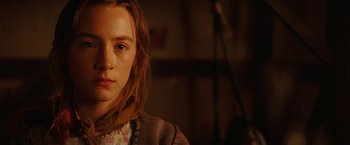 Movie still from “City of Ember” (2008), directed by Gil Kenan – A young girl with long brown hair wearing a plaid shirt; Close Up shot, Low angle