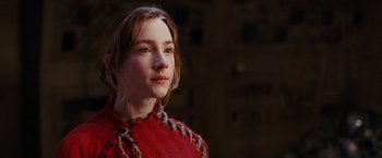 Movie still from “City of Ember” (2008), directed by Gil Kenan – A woman in a red dress is looking at the camera; Close Up shot, Low angle