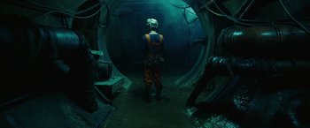 Movie still from “City of Ember” (2008), directed by Gil Kenan – A man standing inside of an underground tunnel; Wide shot, Low angle