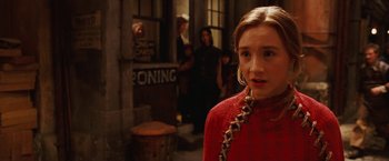 Movie still from “City of Ember” (2008), directed by Gil Kenan – A young girl in a red sweater standing in a street; Close Up shot, Over the shoulder angle