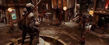 Movie still from “City of Ember” (2008), directed by Gil Kenan – A group of people standing around a building; Extreme Wide shot, High angle