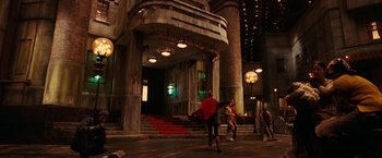 Movie still from “City of Ember” (2008), directed by Gil Kenan – Two people are walking down the street at night; Wide shot, Low angle